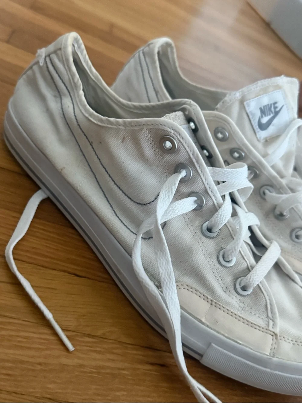 Nike White Low-Top Canvas Sneakers with Silver Eyelets